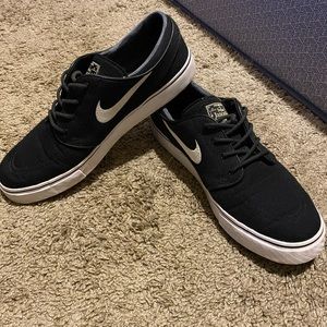 Black and white Nike Janoski shoes